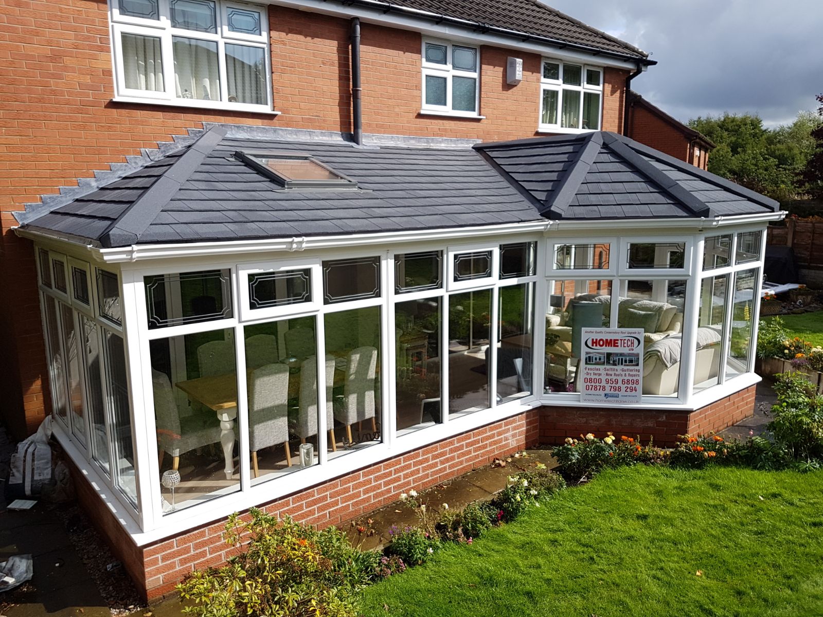 contact roofer in sheffield image showing conservatory with advertisement to contact a roofer in sheffield